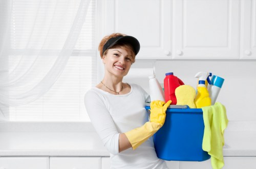 Professional carpet cleaning team working safely with protective equipment