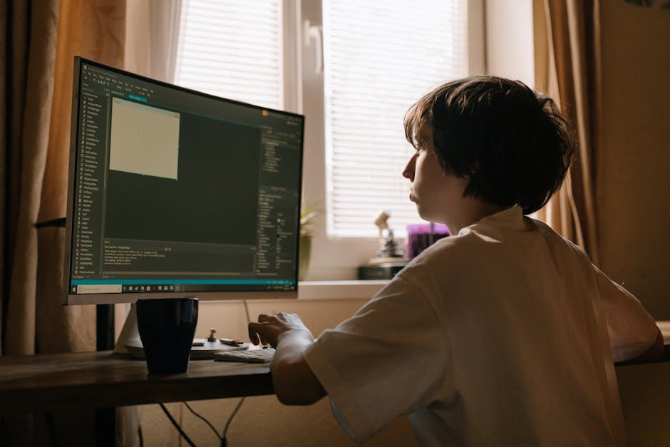 A beige fabric sofa with plush cushions is positioned against a white wall in a well-lit living room, with sunlight casting shadows on a light gray carpet. The sofa appears clean and well-maintained, 